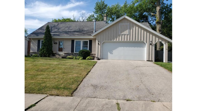 1704 Indianwood Ln Waukesha, WI 53186 by Roots Realty, LLC $242,000