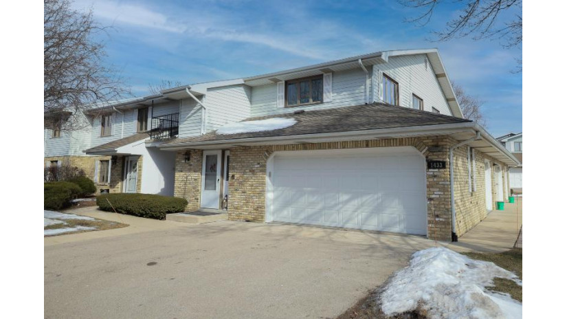 1433 Sun Valley Dr 201 Mount Pleasant, WI 53406 by SynerG Realty LLC $170,000