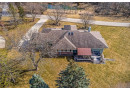 W297N1885 Glen Cove Rd, Delafield, WI 53072 by Compass RE WI-Lake Country $980,000