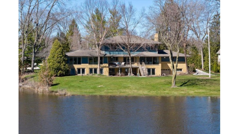 713 Riverview Dr Thiensville, WI 53092 by Realty Executives Integrity~Cedarburg - cedarburgfrontdesk@realtyexecutives.com $1,195,000