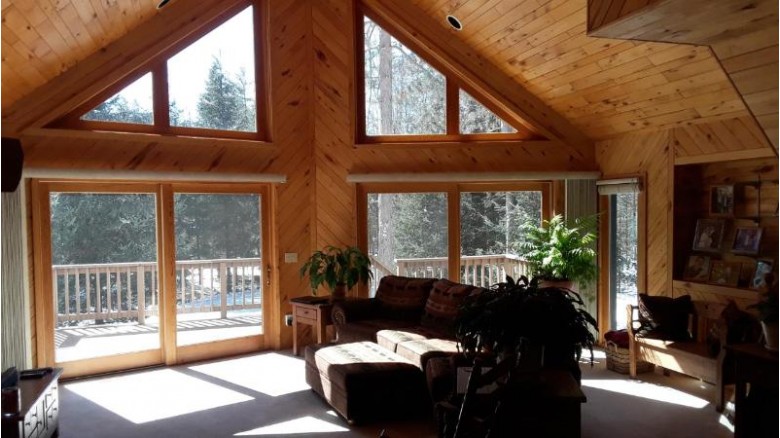 5664 Breezy Pine Rd, Sugar Camp, WI by Coldwell Banker Mulleady-Rhldr $385,900